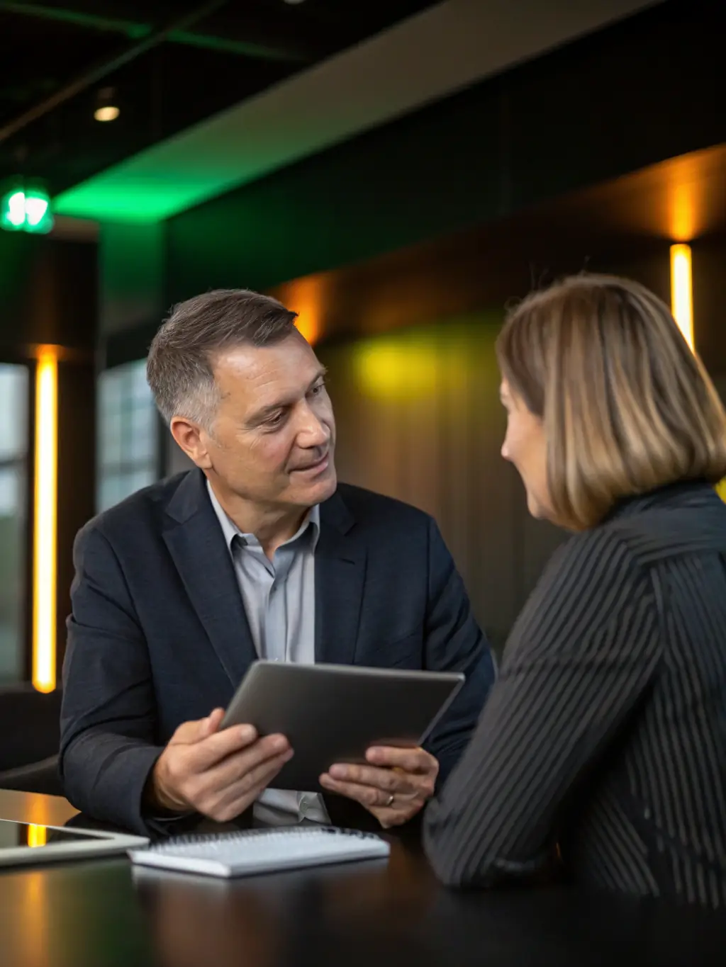 A consultant reviewing a cloud migration plan with a client, showcasing Musa Links' cloud expertise.